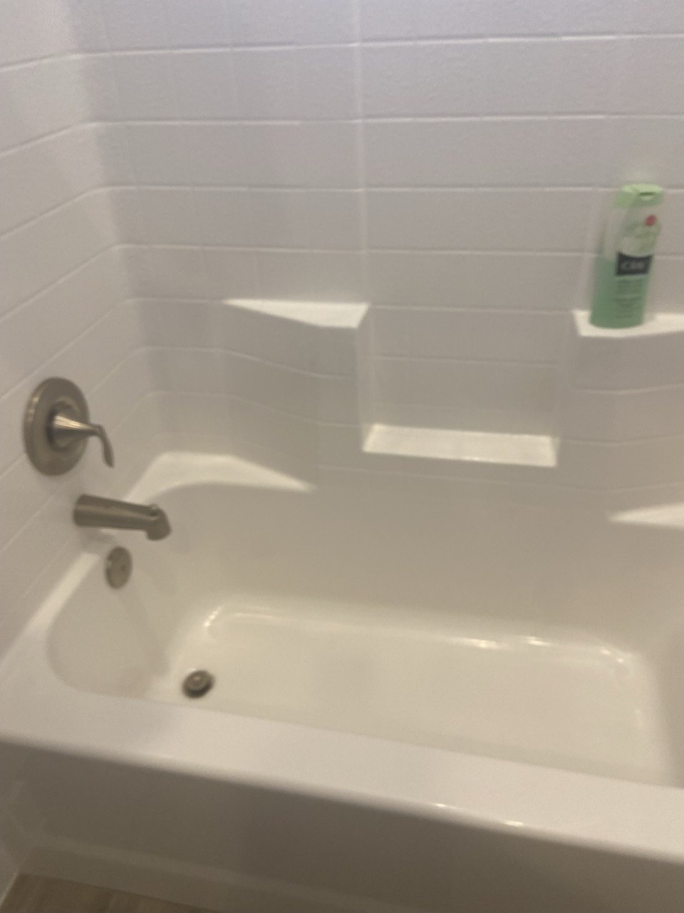 Spotless white bathtub after cleaning